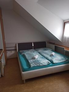 Postel nebo postele na pokoji v ubytování Penzion Pasohlávky