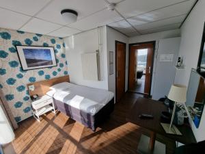 Postel nebo postele na pokoji v ubytování Eemshotel