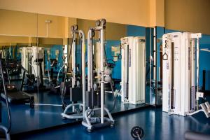 a gym with a bunch of treadms and machines at Bahia Principe Sunlight Costa Adeje - All Inclusive in Adeje