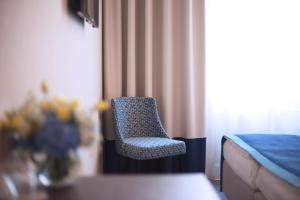 Postel nebo postele na pokoji v ubytování Drei Kronen Hotel Wien City