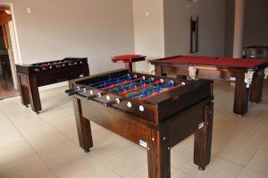 a room with three billiard tables at Pousada Vitalis in Olímpia