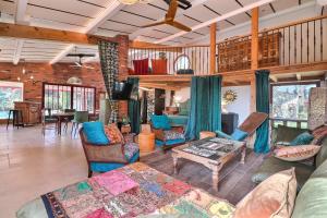 een woonkamer met een bank en een tafel bij The workshop - Atypical loft private swimming pool & garden 3 stars in Aubais