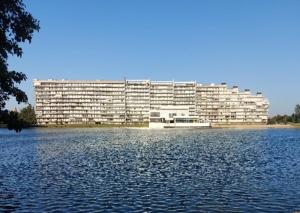 a large building in the middle of a large body of water at Studio Laguna Beach Knokke-Heist in Knokke-Heist