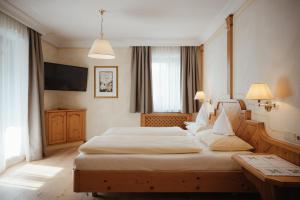 Postel nebo postele na pokoji v ubytování Gourmet Hotel Gran Ander