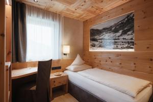 Postel nebo postele na pokoji v ubytování Gourmet Hotel Gran Ander