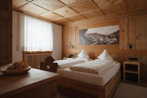Postel nebo postele na pokoji v ubytování Gourmet Hotel Gran Ander