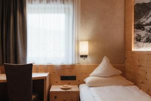 Postel nebo postele na pokoji v ubytování Gourmet Hotel Gran Ander
