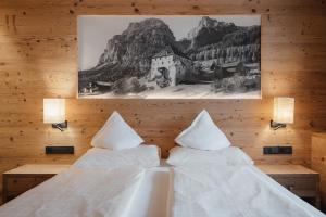 Postel nebo postele na pokoji v ubytování Gourmet Hotel Gran Ander