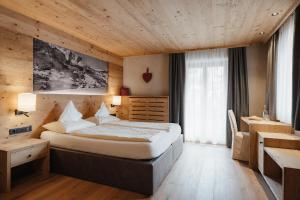 Postel nebo postele na pokoji v ubytování Gourmet Hotel Gran Ander