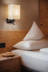 Postel nebo postele na pokoji v ubytování Gourmet Hotel Gran Ander