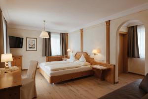Postel nebo postele na pokoji v ubytování Gourmet Hotel Gran Ander