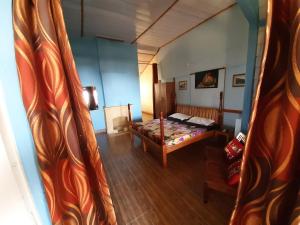 Voodi või voodid majutusasutuse Leela Cottages toas