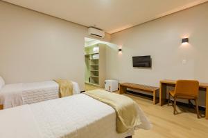 Tri Hotel Antônio Prado客房内的一张或多张床位