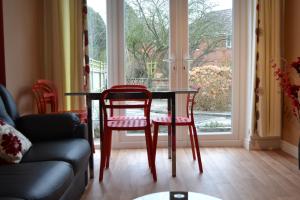 a dining room table and chairs in front of a window at BSL - Filton in Bristol