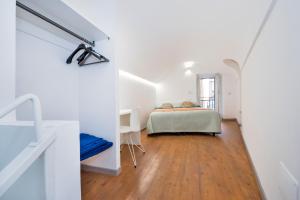 A bed or beds in a room at Piccolo Scrigno