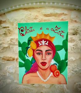 a picture of a woman with a crown on a wall at Chista é a Zita!! in Ragusa