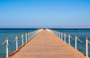 a wooden pier stretches out over the water at Happy Home in Hurghada