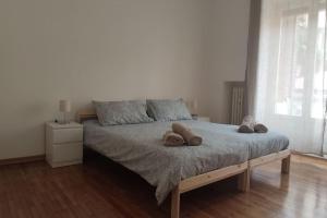 A bed or beds in a room at Incantevole Appartamento Via Molino Delle Armi