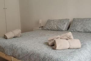 A bed or beds in a room at Incantevole Appartamento Via Molino Delle Armi