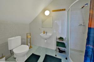 a bathroom with a toilet and a sink and a shower at Penzion Kairos in Klokočí +24 photos