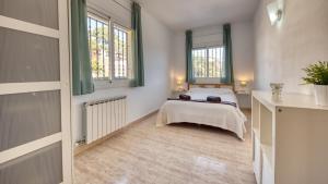 Posteľ alebo postele v izbe v ubytovaní Costacabana - Villa Holiday