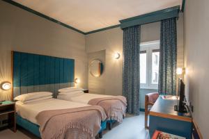 Postel nebo postele na pokoji v ubytování Hotel Milani + 37 fotografií