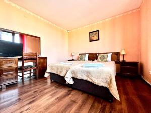 Postel nebo postele na pokoji v ubytování Family Hotel Carpe Diem