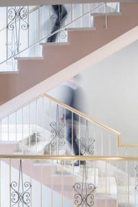 a person walking down the stairs at Hotel Milani in Rome