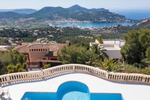 a villa with a view of the water at Holiday Villa Port d'Andratx in Port d'Andratx
