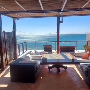 a living room with a view of the ocean at Balcon sur l'ocean in Taghazout