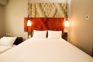 A bed or beds in a room at ibis Lima Reducto Miraflores