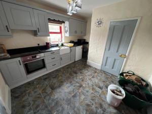 Kuchyň nebo kuchyňský kout v ubytování Carraun Cottage