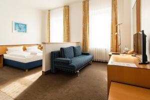 Postel nebo postele na pokoji v ubytování Strandhotel Bansiner Hof + 25 fotografií