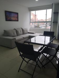 Uma área de estar em Elite Home Apartamentos