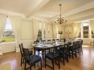 a large dining room with a long table and chairs at Green Craig in Aberlady