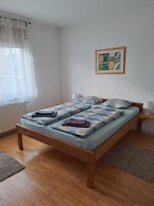 a bed sitting in a room with at sara1 in Slavonski Brod
