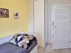 Łóżko lub łóżka w pokoju w obiekcie visit baltic - na Platanie