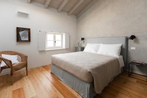 A bed or beds in a room at Casa Perazzolo