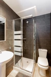a bathroom with a shower and a toilet and a sink at Casa Lili in Moraira