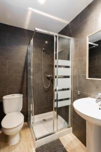 a bathroom with a shower and a toilet and a sink at Casa Lili in Moraira