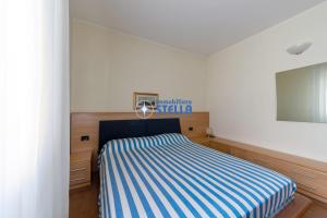 En eller flere senger på et rom på Condominio Adriatico