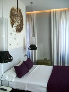 Ein Bett oder Betten in einem Zimmer der Unterkunft Khu Hotel