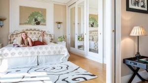 Кровать или кровати в номере Cala del Porto Punta Ala - Preferred Hotels