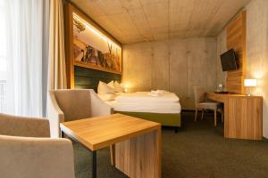 Postel nebo postele na pokoji v ubytování Hotel am Fischerstrand