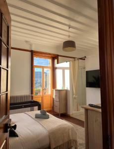 Łóżko lub łóżka w pokoju w obiekcie O'Cottage suite Familiale