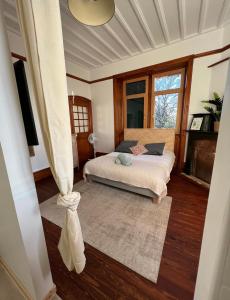 Łóżko lub łóżka w pokoju w obiekcie O'Cottage suite Familiale
