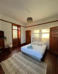 Łóżko lub łóżka w pokoju w obiekcie O'Cottage suite Familiale