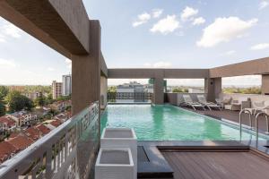a swimming pool on the roof of a building at Mizuki in Nairobi