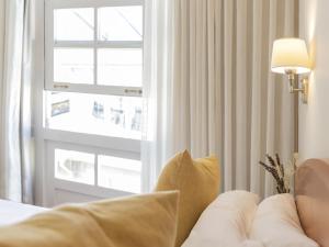 Hostal ALBA Lugo客房内的一张或多张床位