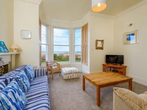 a living room with a couch and a table at TenSea in North Berwick